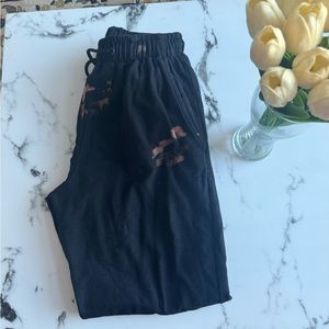 Black, brown drawstring sweatpants.